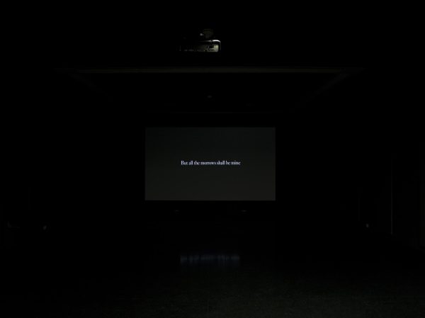 A black screen that bears white text reads 