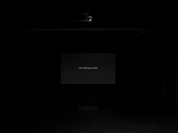 A black screen that bears white text reads 