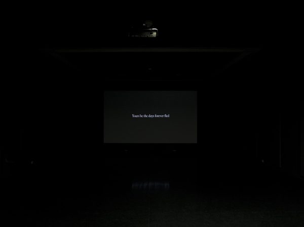A black screen that bears white text reads 