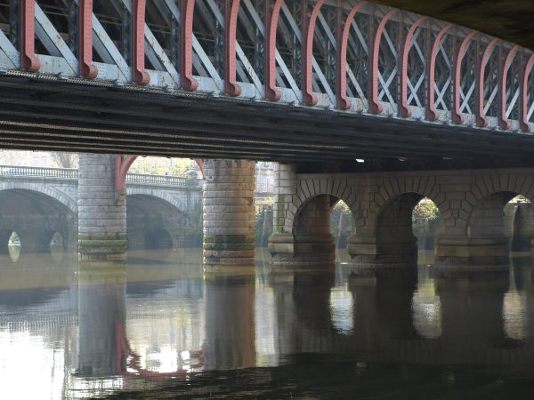 A series of bridges viewed from the bank of a river