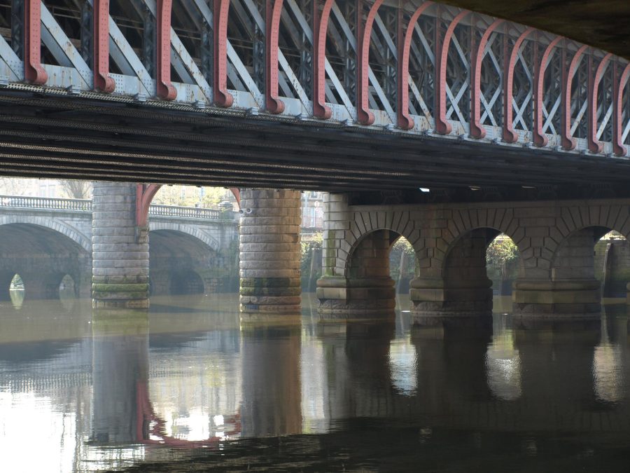 A series of bridges viewed from the bank of a river