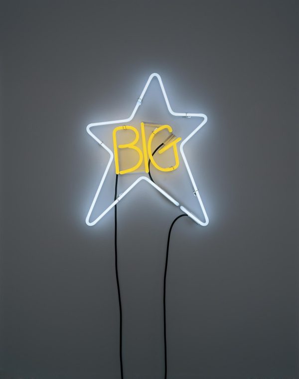 Neon light formed into yellow words that read Big inside a white star shape