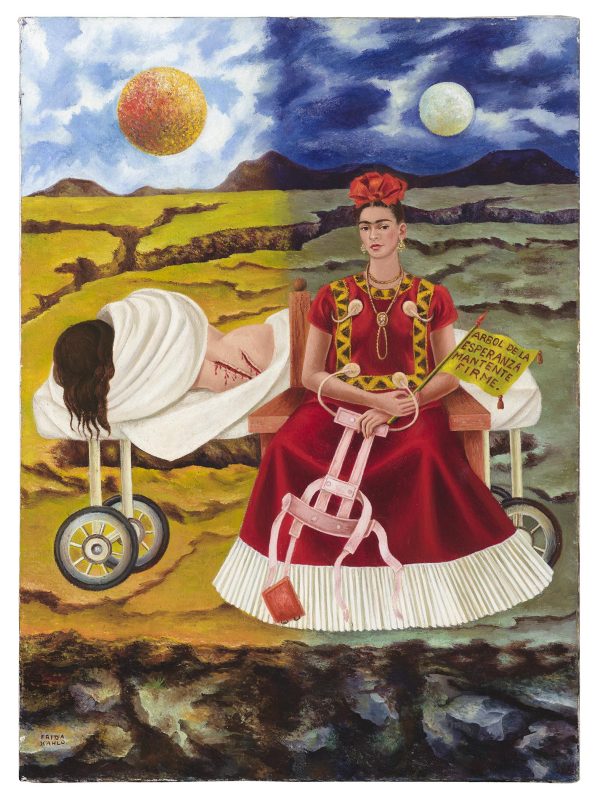 Vivid painting of a desert landscape, which is divided in half by day and night, and two women in the foreground—one seated wearing an elaborate red dress, the other lying on a cart nude, wounded, and wrapped in a white sheet