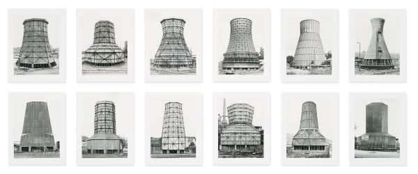 Two rows of six black and white images of large cylindrical chimneys