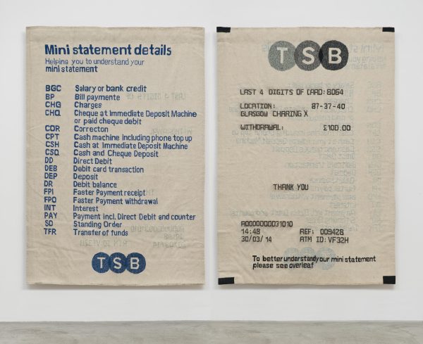 Two TSB receipts hung on a white wall
