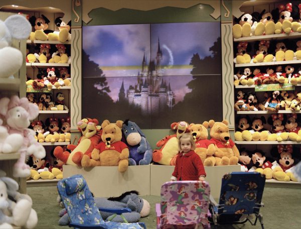 A child amongst toys in a Disney store