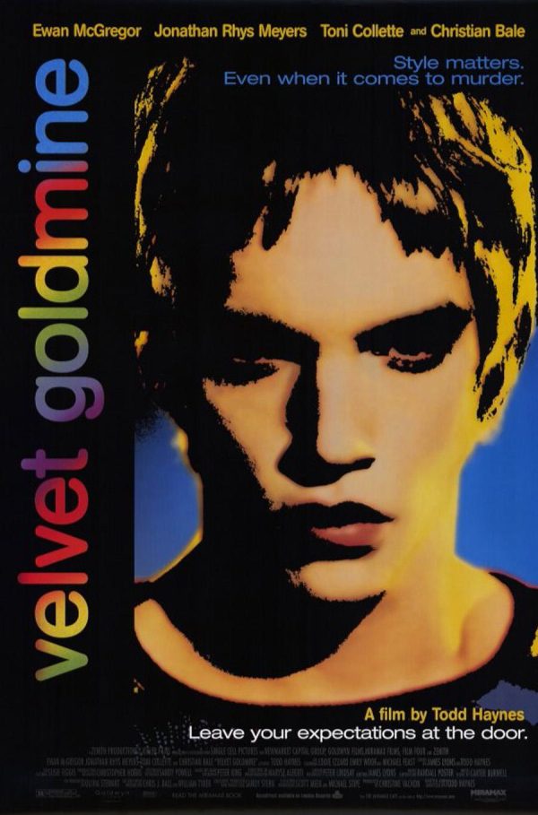 A graphic poster for a movie starring Ewan McGregor, the portrait of a man in highly saturated colors and jet black shadows with 