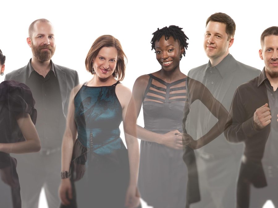 Six smiling people in a line wearing dark-colored formal wear, their bodies are transparent and overlap at the shoulder