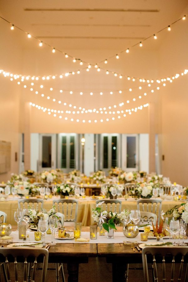 String lights hang over tables in the MCA's atrium