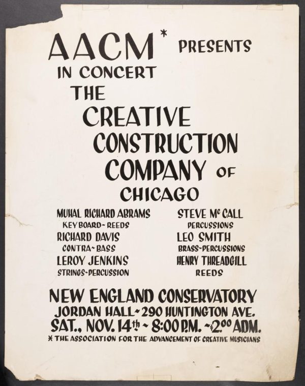 A yellowed and tattered poster with black text reads, 