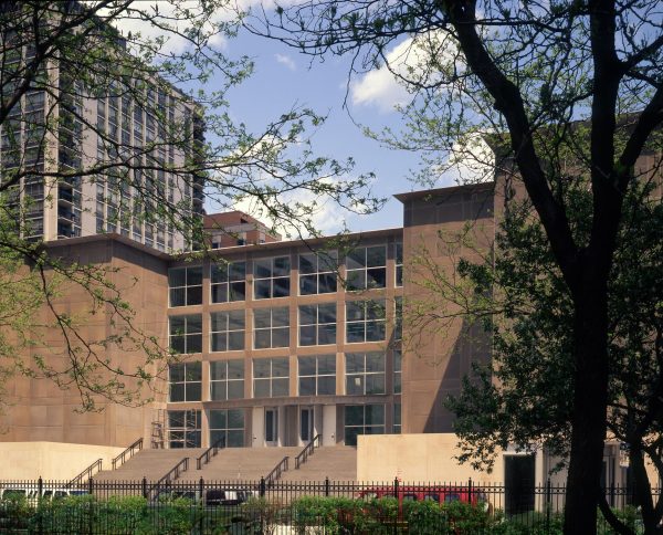 view of the MCA entrance on a sunny day from Seneca Park across the street