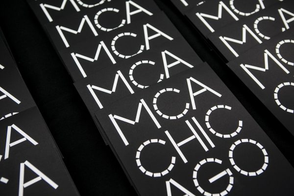 Rows of black folders with a white logo that reads 