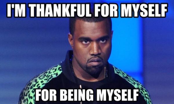 Portrait of musician Kanye West shows a dark-skinned man with short black hair and a goatee, with white letters that read, above: 
