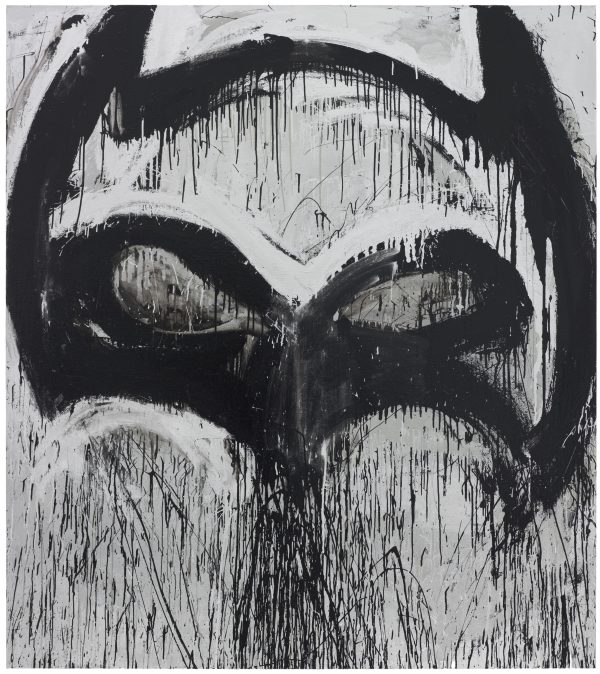 Thick black paint creates the outline of the Batman mask against a silver background with a lot of black paint drips