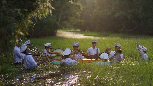 A band plays in a swamp partially submerged