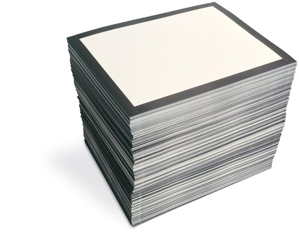 A stack of paper with a black border printed on the top one