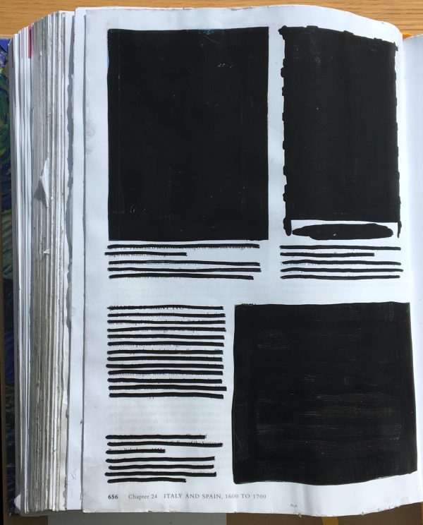 A page of a book that had its images and text redacted