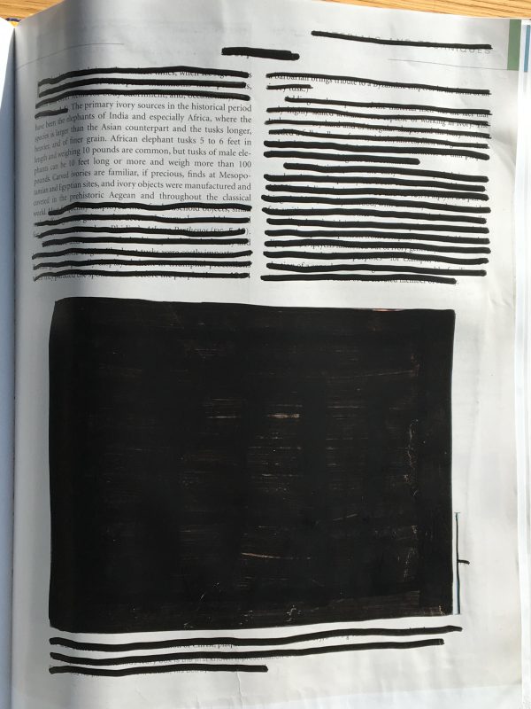 A page of a book that had its images and text redacted except for one paragraph