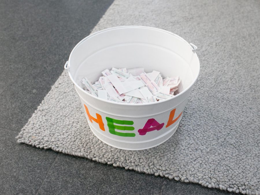 A white pail labeled 