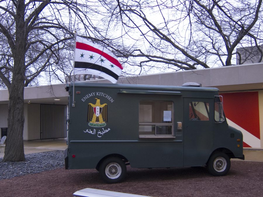 An army green food truck labeled Enemy Kitchen