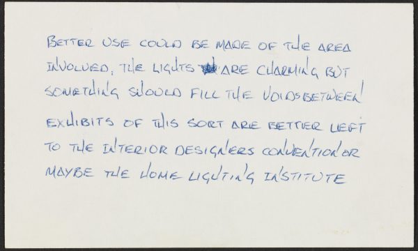 An index card with handwritten text 