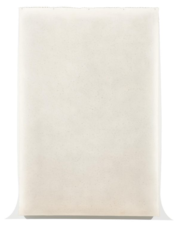 A cream colored piece of paper with a lighter border curves outward at the bottom