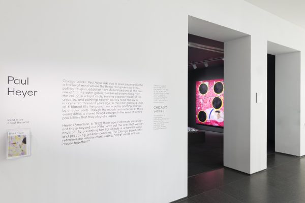 An exterior shot of an art gallery reads 