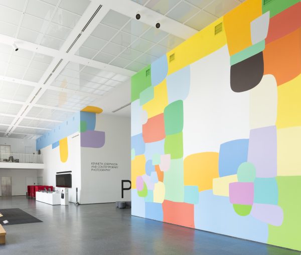 The MCA Atrium features a prominent, colorful mural on multiple walls.