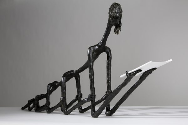 A black, bearded figure's body is composed of five pairs of spindly arms, each grabbing the pair in front them.