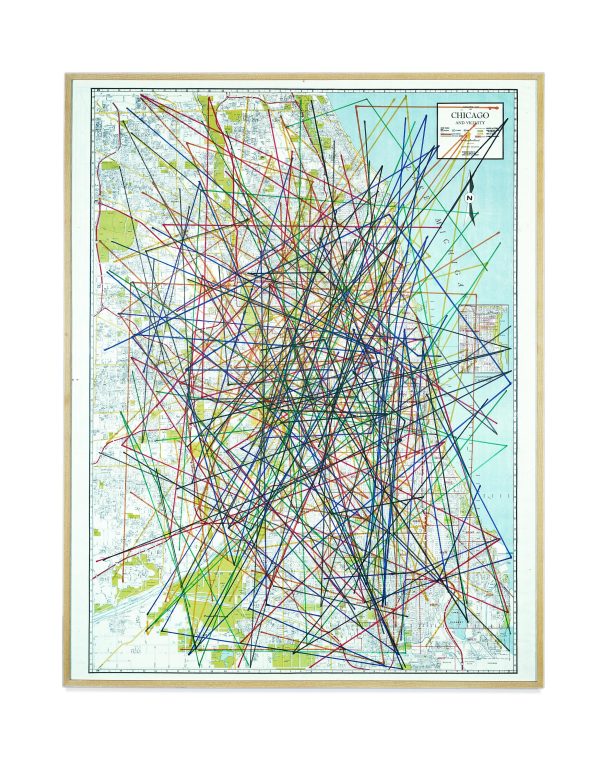 A framed map of the Chicagoland area is crisscrossed by many dozens of multi-colored marker lines.