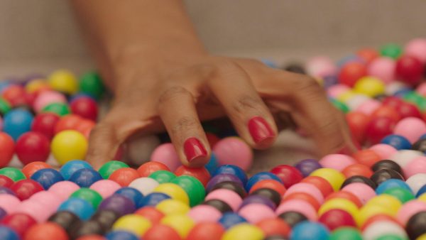 Close up of a hand grabbing marbles