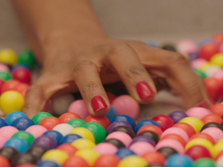 Close up of a hand grabbing marbles
