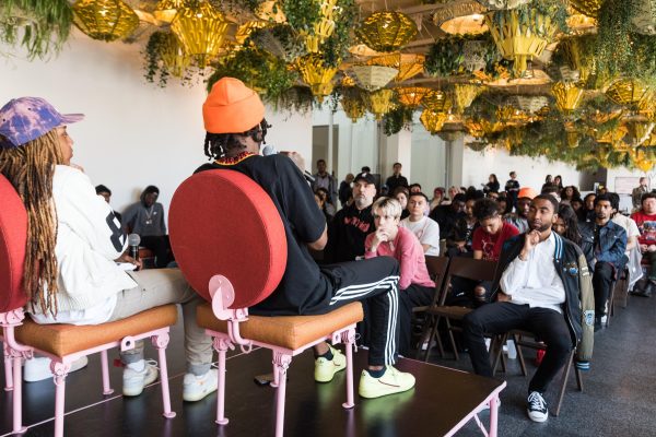 panel speakers look out on a full seated audience in the MCA commons gallery