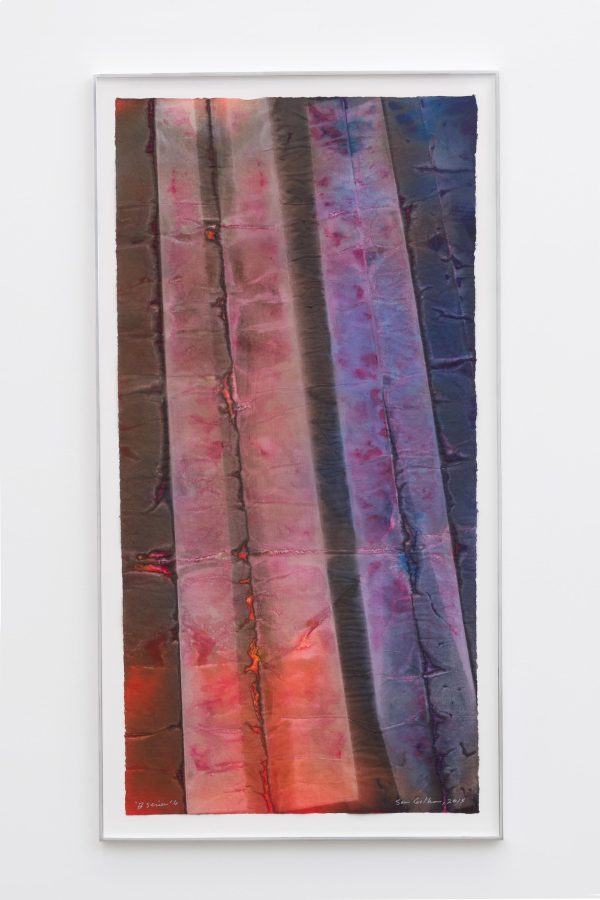 A vertical image shoes two tower-like shapes, one red and one purple. They are abstract but gruesome, resembling a wound or something rotting.
