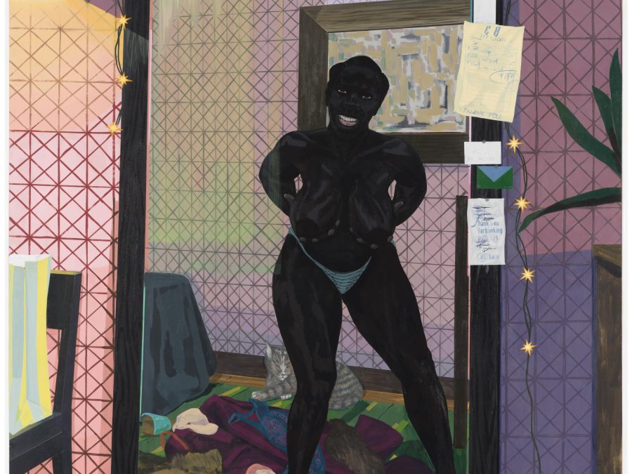 A woman stands mostly nude in front of a mirror surrounded by discarded clothing. She holds her breasts in her hands as a large grin spreads across her face.