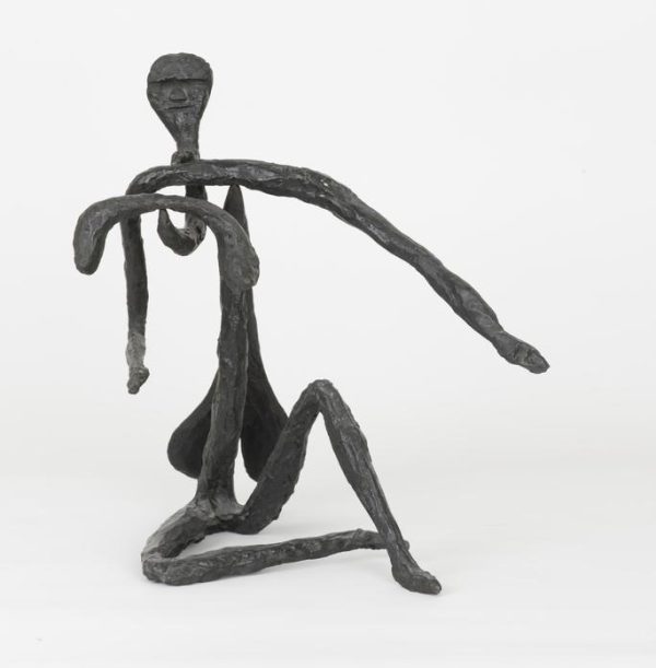 bronze sculpture resembling a person, limbs balancing on point