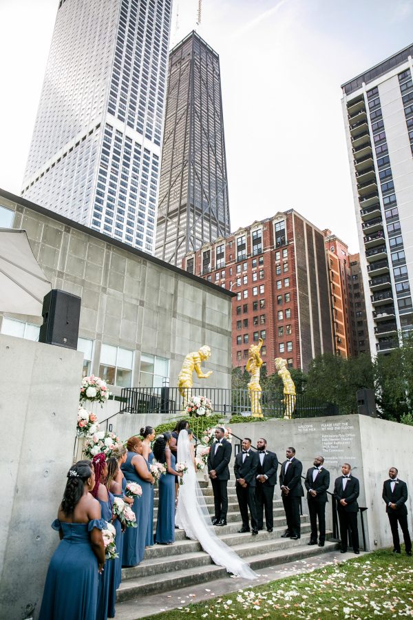 A wedding party standing in formation during a ceremony
