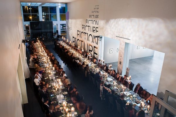 a large group dining at a wedding reception