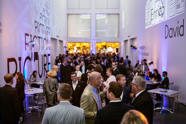 large crowd mingles at event