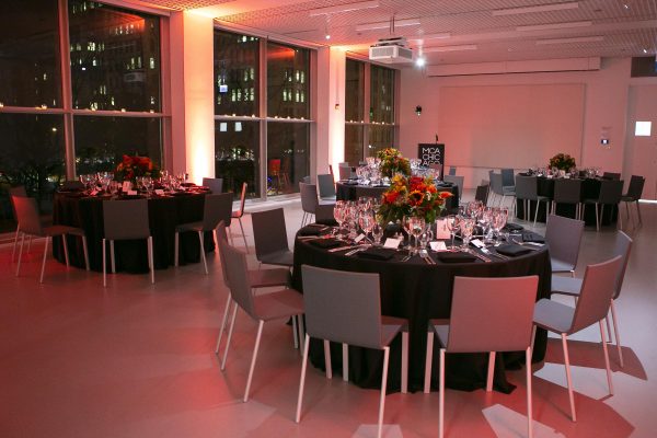 round tables set in a dimly lit room